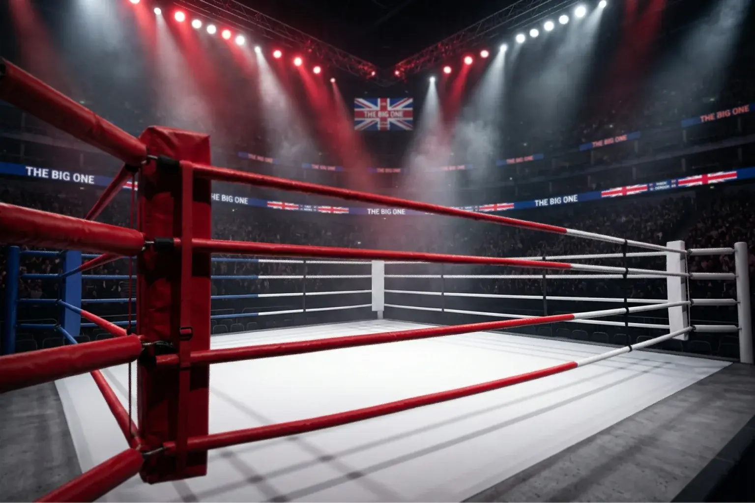 Professional boxing ring under dramatic spotlights with red corner ropes in a British arena